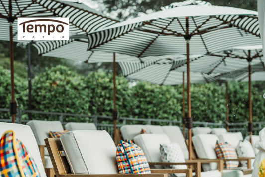 Best portable patio umbrellas for small spaces line a row of lounge chairs outdoors