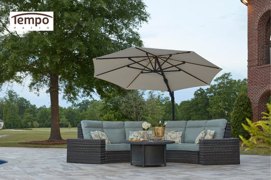 How umbrella shade compares to structures with a tilted beige umbrella covering a wicker sectional sofa on the patio.
