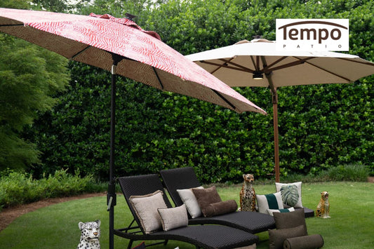 Semi permanent patio umbrellas explained with red and tan canopies shading a backyard lounge area.