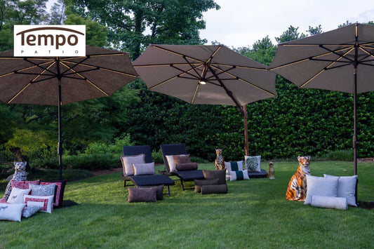 Three lit cantilever umbrellas over lawn loungers illustrating why portable umbrellas are useful outdoors